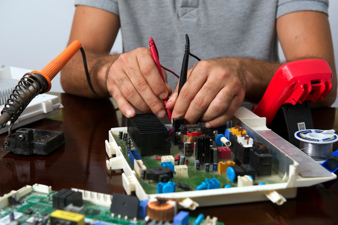 Technician repairing an appliance