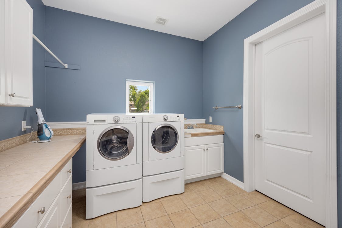 Home laundry room with washer and dryer