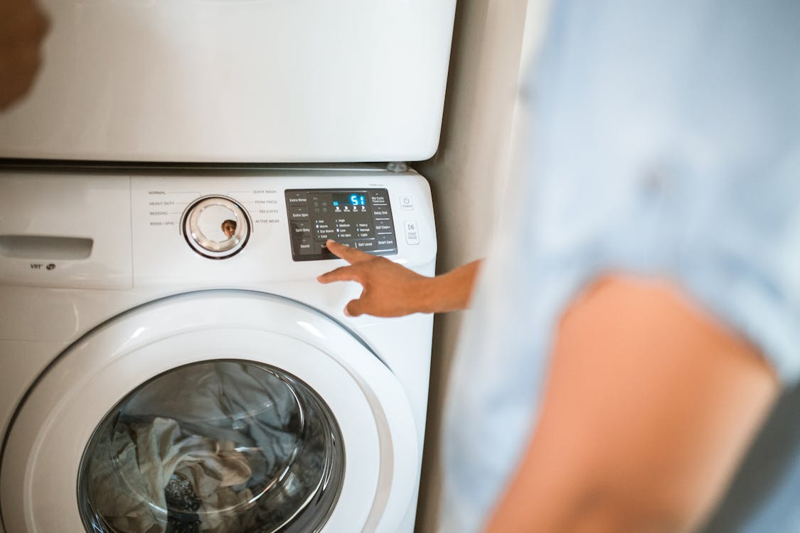 Person using a washing machine